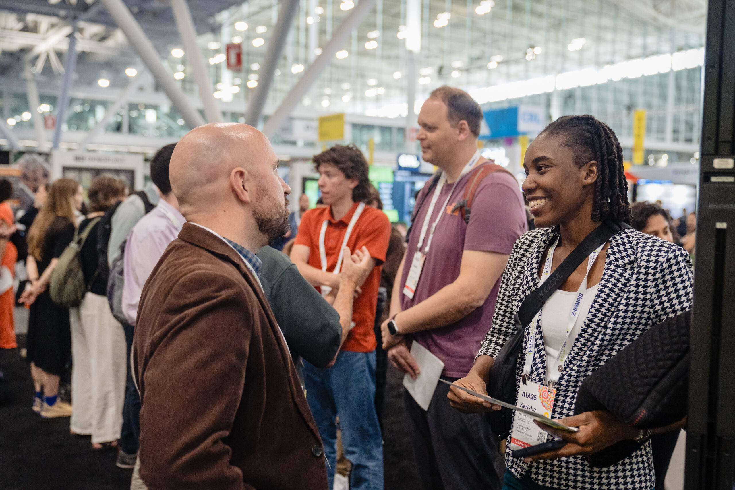 Attendees in deep discussion networking at conference