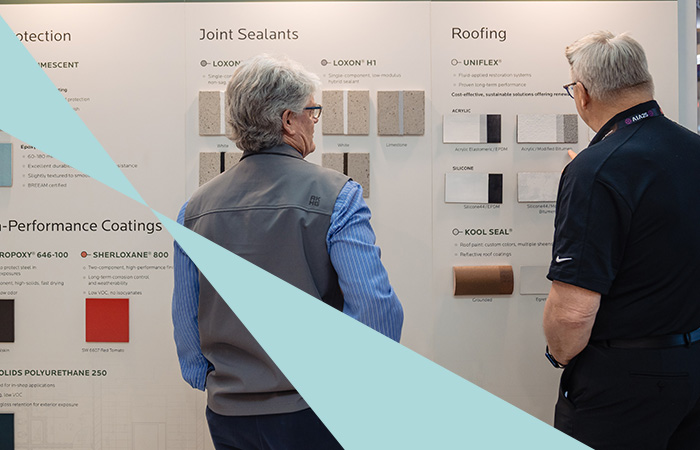 Attendees looking at new materials at AIA25