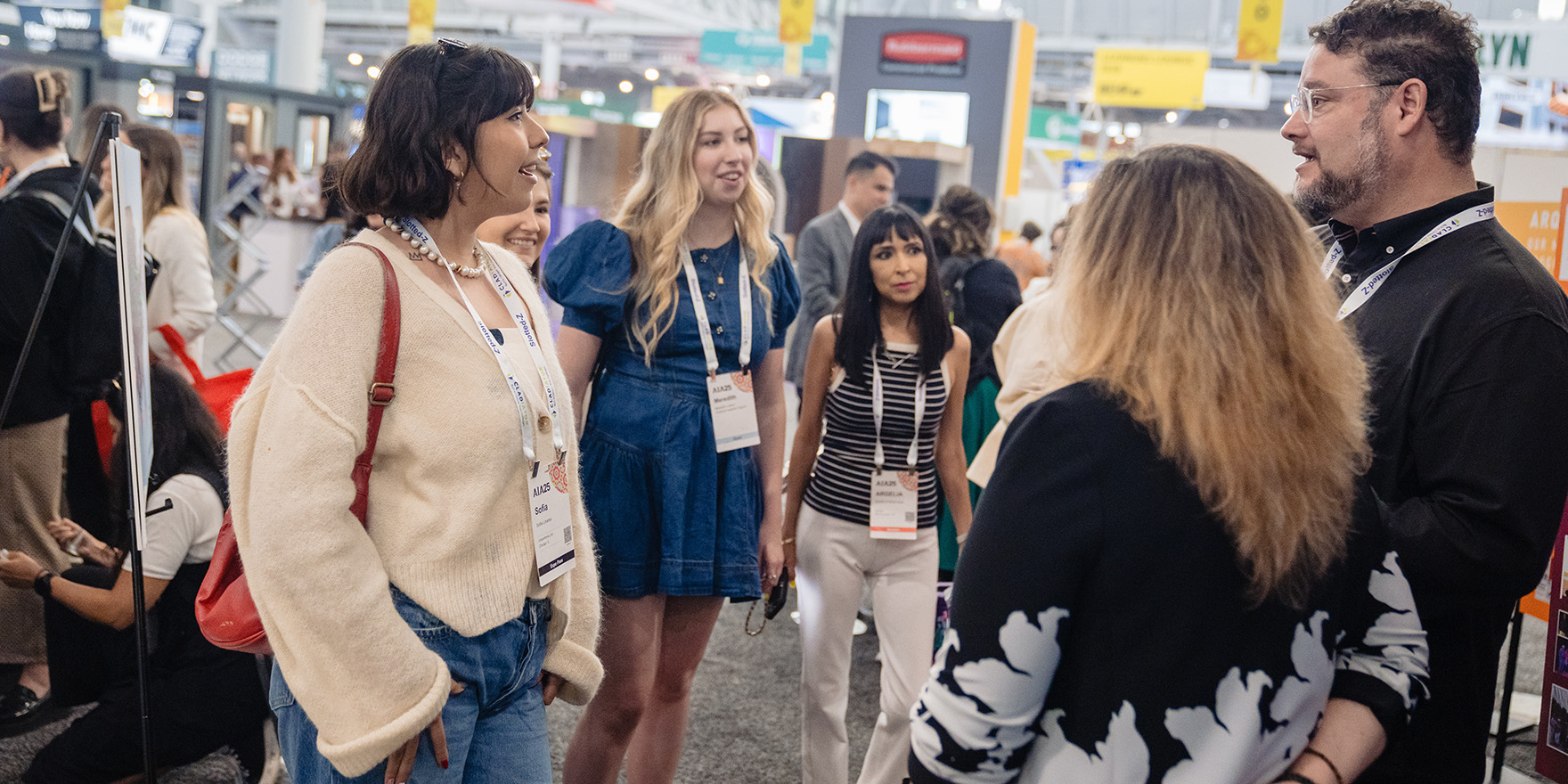 Attendees conversing at AIA Conference on Architecture & Design